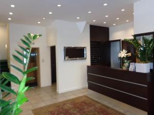 TV a/nebo společenská místnost v ubytování Hotel Emperador