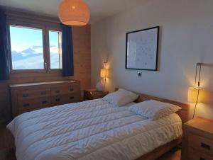 Postel nebo postele na pokoji v ubytování Paradiski nouveau, calme et ensoleillé vallandry