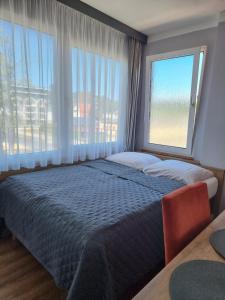 Posteľ alebo postele v izbe v ubytovaní Gościniec pod Polną Różą 2