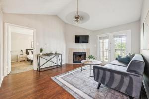 a living room with a couch and a fireplace at The Davis 1824 I Spacious 2 Bed 2 Bath in Huntsville