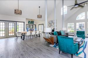a living room with a couch and a table and chairs at The Davis 1824 I Spacious 2 Bed 2 Bath in Huntsville