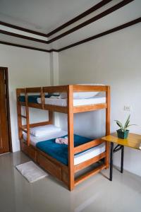 Postel nebo postele na pokoji v ubytování Hapitanan Siargao