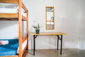 Postel nebo postele na pokoji v ubytování Hapitanan Siargao