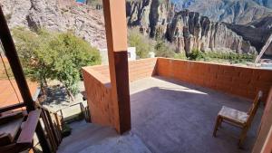 a balcony with a view of the mountains at El mirador de iruya in Iruya
