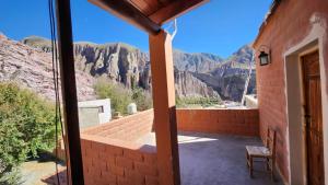 a room with a view of the mountains at El mirador de iruya in Iruya