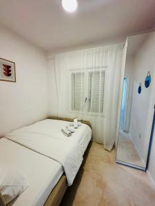 Postel nebo postele na pokoji v ubytování PHOS - Pag Residencies