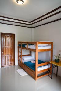 Postel nebo postele na pokoji v ubytování Hapitanan Siargao + 27 fotografií