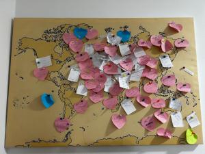 a map of the world covered in pink hearts at Apartment Liriq - Free Parking in Sarajevo