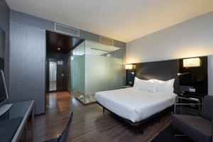 Eurostars Monte Real tesisinde bir odada yatak veya yataklar
