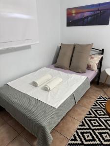 Postel nebo postele na pokoji v ubytování Κεντρικό Ημιυπόγειο Διαμέρισμα