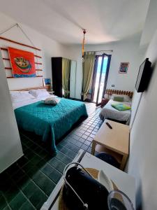Postel nebo postele na pokoji v ubytování Casa Stone Milazzo B&B