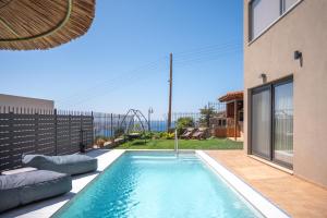 a swimming pool in the backyard of a house at Diosa Luxury Living with Private Pool in Lygaria