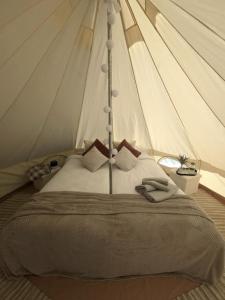 Postel nebo postele na pokoji v ubytování Kiideva Glamping + 4 fotografie