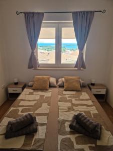 Postelja oz. postelje v sobi nastanitve Apartment Lea