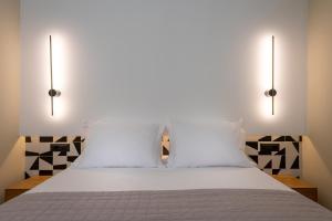 Postel nebo postele na pokoji v ubytování Sokaki Alley Houses