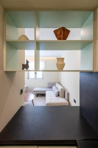 Postel nebo postele na pokoji v ubytování Sokaki Alley Houses