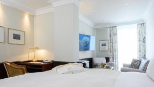 Postel nebo postele na pokoji v ubytování Colombi Hotel