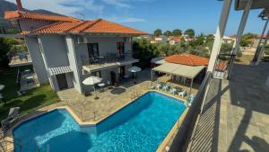 an aerial view of a house with a swimming pool at Aliston Hotel Thassos in Skala Potamias