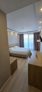 Postel nebo postele na pokoji v ubytování Amber Hotel Albania