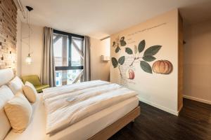 Postel nebo postele na pokoji v ubytování Hotel Greuterhof Islikon