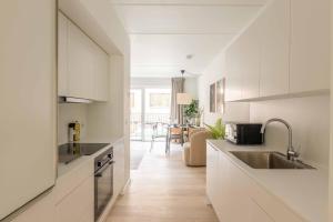 Η κουζίνα ή μικρή κουζίνα στο Beautiful Bright Apartments in Carlsbergbyen