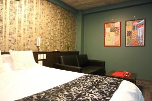 Postel nebo postele na pokoji v ubytování HOTEL neoWorld