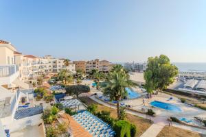an aerial view of a resort with a swimming pool at H&O Sea & Sun Apartment in Paphos City