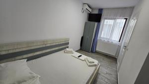 Postel nebo postele na pokoji v ubytování Vila duMio
