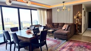 a living room with a table and a couch at Daik City Chaviland Fully Furnished Apartment in As Sulaymānīyah