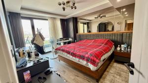 a bedroom with a bed and a large mirror at Daik City Chaviland Fully Furnished Apartment in As Sulaymānīyah +21 photos