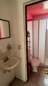 a bathroom with a sink and a toilet at Casa Cairo in San Juan del Río