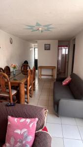 a living room with a couch and a table at Casa Cairo in San Juan del Río +8 photos