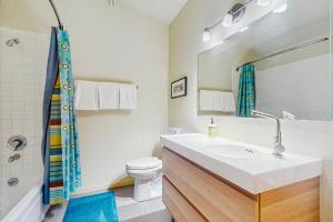 a bathroom with a sink and a toilet at Gore Creek Condo in Vail +11 photos