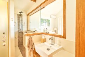 a bathroom with a sink and a shower at SG17 Villa Sable Front de Mer in Palmar +50 photos