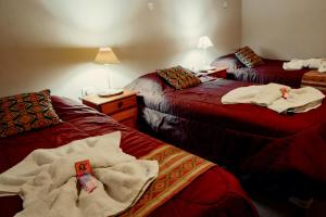 Ένα ή περισσότερα κρεβάτια σε δωμάτιο στο Hotel Sante
