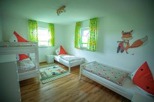 a room with two bunk beds and a couch at Fuchsbau Erdgeschoß in Burtenbach