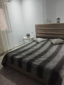 Ένα ή περισσότερα κρεβάτια σε δωμάτιο στο kelibia ezzahra plage appart a 170 m du plage