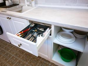 a kitchen counter with a white counter top at Apartment Saint George in Dobrich +21 photos