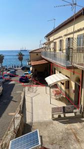 a building with a solar panel next to the ocean at Casa marina civico 3 in Pizzo