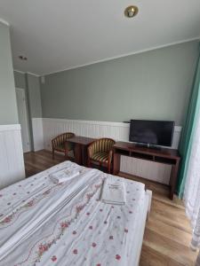 Łóżko lub łóżka w pokoju w obiekcie AGIS Pokoje Gościnne