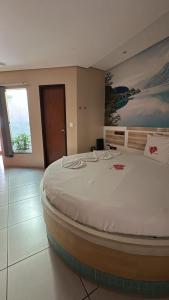 a bedroom with a large bed in a room at Taj Mahal Motel in Barbalha +10 photos