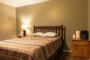 a bedroom with a bed with two pillows on it at Lakeview Room 2 Queens - 22 in Mead
