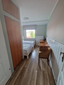 Łóżko lub łóżka w pokoju w obiekcie AGIS Pokoje Gościnne