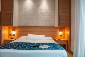 Postel nebo postele na pokoji v ubytování Hotel Tropical