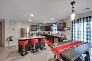 a kitchen with a table and red stools in it at 4BR 2 and Half BA Family Retreat in Columbia