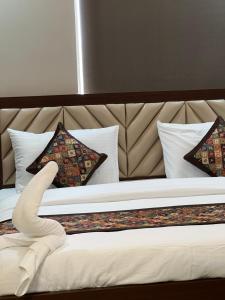 Postel nebo postele na pokoji v ubytování RJ-02 Hotel