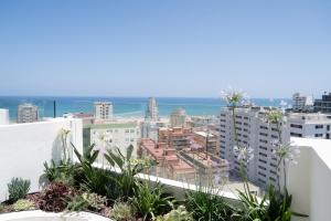 a view of the city from the balcony of a building at Hotel RH Arena - Todo Incluido in Gandía