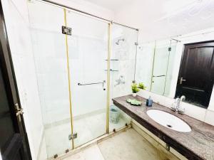 a bathroom with a shower and a sink at G-town living in Gurgaon +11 photos