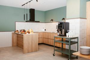 a kitchen with a counter and a microwave oven at Hostal Ainhoa in Tafalla