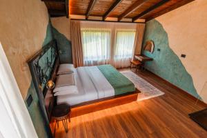 Voodi või voodid majutusasutuse Hotel Thethi toas